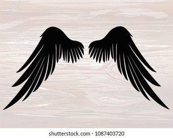 Black silhouette Wings. Vector illustration on wooden background. 