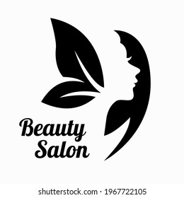 Black silhouette of a woman with foliage. Beauty salon logo
