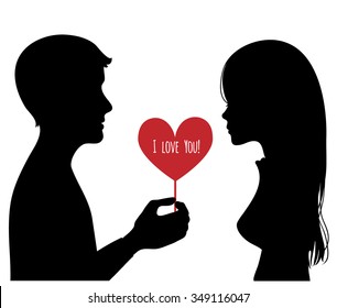 Black silhouette of young couple. Man presents a heart to woman. Vector image