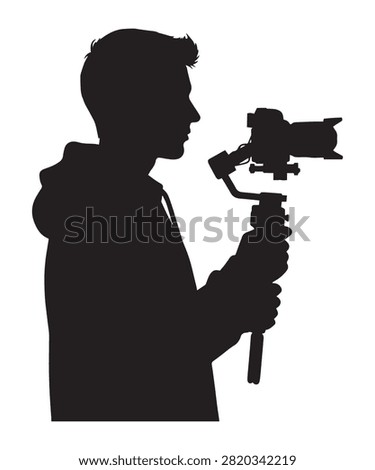 A black silhouette of a young videographer holding a professional camera mounted on a handheld gimbal stabilizer.