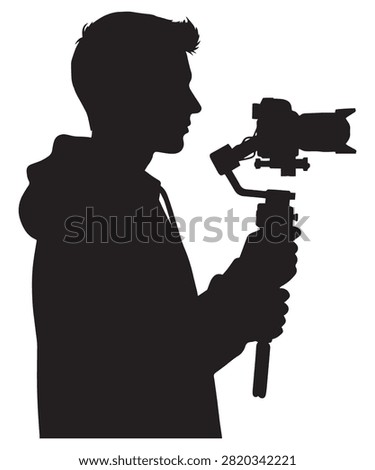 A black silhouette of a young videographer holding a professional camera mounted on a handheld gimbal stabilizer.