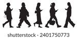 Black silhouettes of 5 walking women with phones isolated on white background. Side view. Vector illustration.