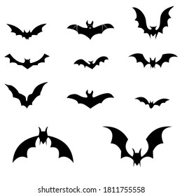 Black silhouettes of bats set on white background. vector 