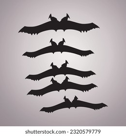 Black silhouettes of bats set on white isolated background.