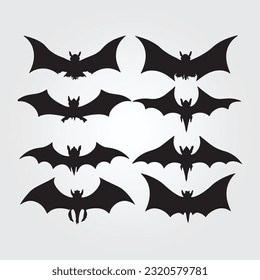 Black silhouettes of bats set on white isolated background.