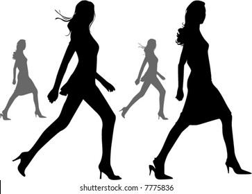 black silhouettes of  beautiful walking weman on the white