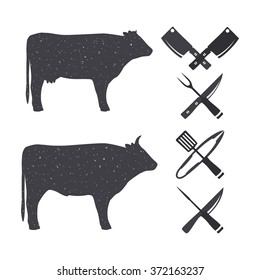 Black silhouettes of a bull and a cow. Butchery Design Elements. Isolated on a white. Vector illustration.