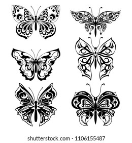 Black silhouettes of butterflies. Set of filigree isolated silhouettes. Decorative abstract design element. Vector illustration