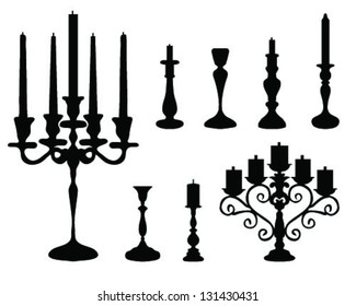 Black silhouettes of candlesticks-vector