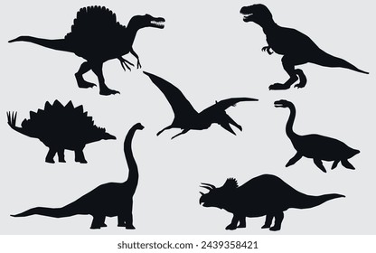 Black silhouettes of dinosaurs. Vector on a gray background