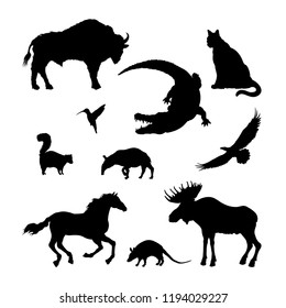 Black silhouettes of North American animal. Isolated image of elk, bison, crocodile on white background. Wildlife graphic. Vector illustration