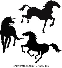 black silhouettes of running horses