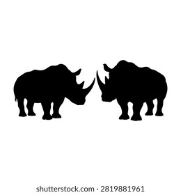 Black silhouettes of two rhinoceroses facing each other against a white background, emphasizing their distinctive horns and robust bodies.