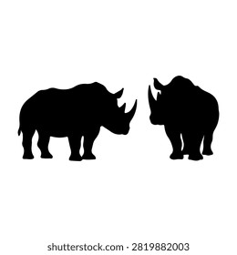Black silhouettes of two rhinoceroses facing each other, highlighting their distinctive horns and robust bodies, set against a plain background.