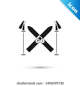 Black Ski and sticks icon isolated on white background. Extreme sport. Skiing equipment. Winter sports icon.  Vector Illustration