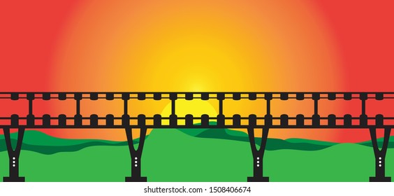 Black sky walk over bridge on sun set and mountain background