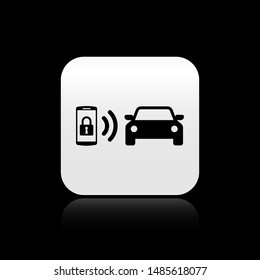 Black Smart car alarm system icon isolated on black background. The smartphone controls the car security on the wireless. Silver square button. Vector Illustration