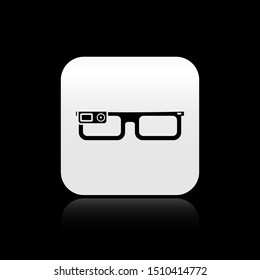 Black Smart glasses mounted on spectacles icon isolated on black background. Wearable electronics smart glasses with camera and display. Silver square button. Vector Illustration