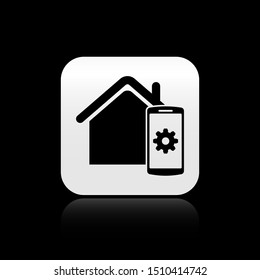 Black Smart home - remote control system icon isolated on black background. Silver square button. Vector Illustration