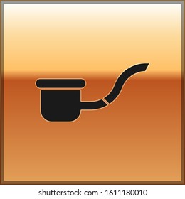 Black Smoking pipe with smoke icon isolated on gold background. Tobacco pipe.  Vector Illustration