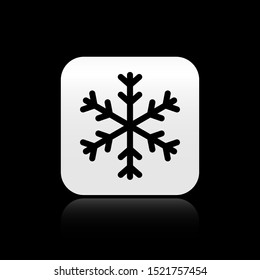 Black Snowflake icon isolated on black background. Silver square button. Vector Illustration