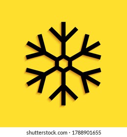 Black Snowflake icon isolated on yellow background. Long shadow style. Vector.