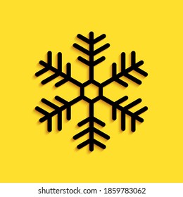 Black Snowflake icon isolated on yellow background. Long shadow style. Vector.
