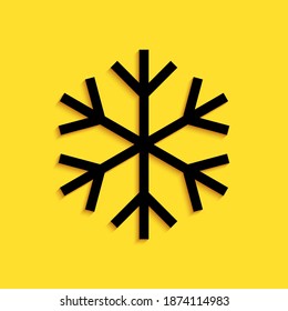 Black Snowflake icon isolated on yellow background. Long shadow style. Vector.