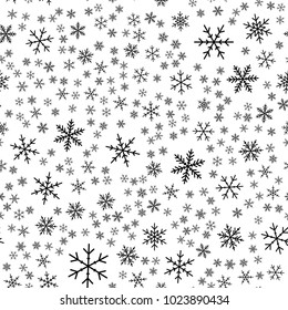 Black snowflakes seamless pattern on white Christmas background.