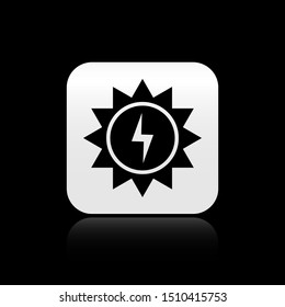 Black Solar energy panel icon isolated on black background. Sun with lightning symbol. Silver square button. Vector Illustration