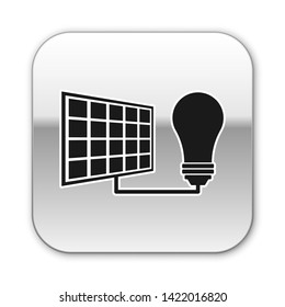 Black Solar energy panel and light bulb icon isolated on white background. Silver square button. Vector Illustration