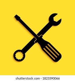 Black Spanner and screwdriver tools icon isolated on yellow background. Service tool symbol. Long shadow style. Vector.