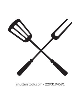 Black spatula and fork on a white background with copy space