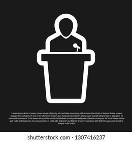 Black Speaker icon isolated on black background. Orator speaking from tribune. Public speech. Person on podium. Vector Illustration