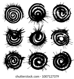Black spiral circles of ink. Set of grungy swirling circles. Swirling grungy elements. Inky spiral movement
