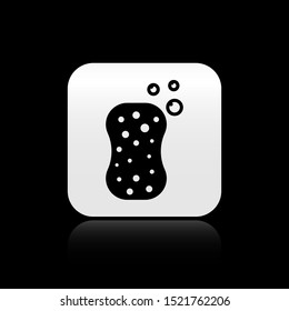 Black Sponge with bubbles icon isolated on black background. Wisp of bast for washing dishes. Cleaning service logo. Silver square button. Vector Illustration