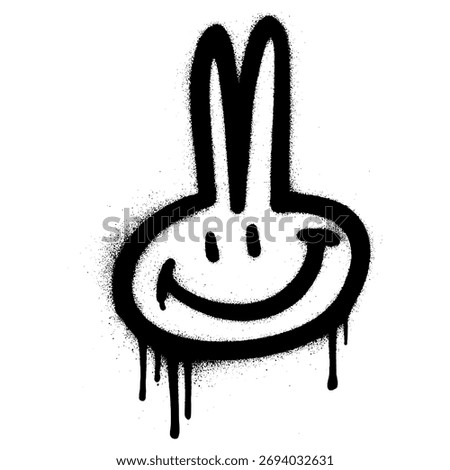 Black spray paint graffiti of a smiling bunny emoji with two long ears, dripping paint effect on white background for street art lovers.