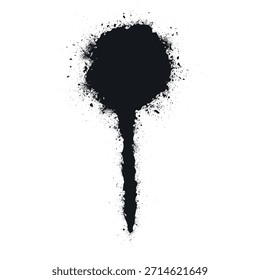 Black spray paint spot with splashes made by a spray can on a white surface during an art activity in a creative space.