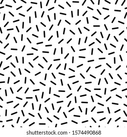 Black sprinkle pattern on white background. Monochrome seamless pattern. Great for wallpaper, web background, wrapping paper, fabric, packaging, greeting cards, invitations and more.