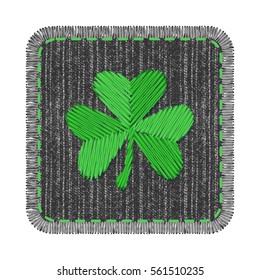 Black square denim patch with green shamrock embroidery, stitch and fringe. Rectangle jeans fabric with Irish symbol of Saint Patricks Day.