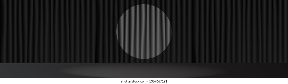 Black stage scene and spot light in center .  Open microphone curtain .