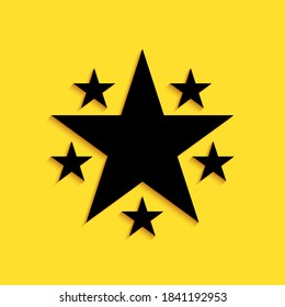 Black Star icon isolated on yellow background. Favorite, Best Rating, Award symbol. Long shadow style. Vector.