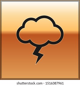 Black Storm icon isolated on gold background. Cloud and lightning sign. Weather icon of storm.  Vector Illustration