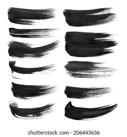 Black strokes painted with paint on white background