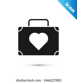 Black Suitcase for travel with heart icon isolated on white background. Honeymoon symbol. Traveling baggage sign. Travel luggage icon.  Vector Illustration