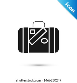 Black Suitcase for travel and stickers icon isolated on white background. Traveling baggage sign. Travel luggage icon.  Vector Illustration