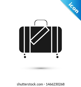Black Suitcase for travel and stickers icon isolated on white background. Traveling baggage sign. Travel luggage icon.  Vector Illustration