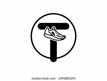 Black T initial letter with shoes in circle design