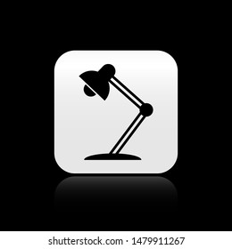 Black Table lamp icon isolated on black background. Table office lamp. Square button vector Illustration