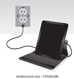 Black Tablet Charging From Usb Outlet On Light Background. Mobile Phone Charge